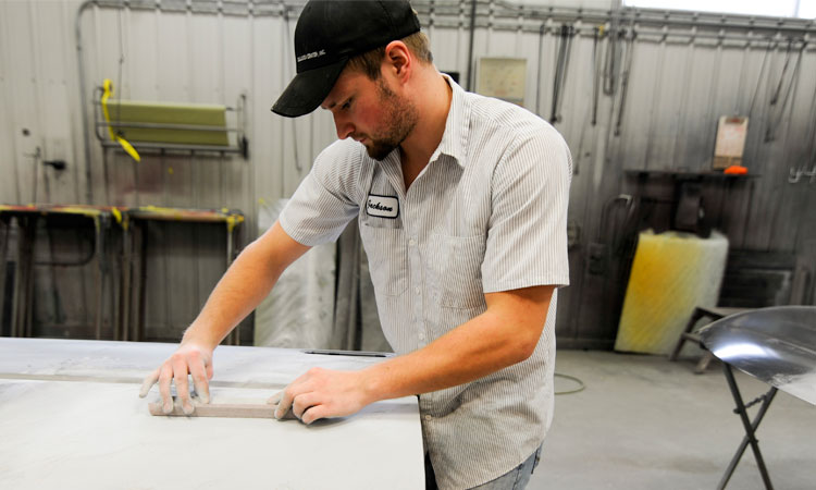 Hand sanding auto body work at Collision Center Inc. Chippewa Falls WI